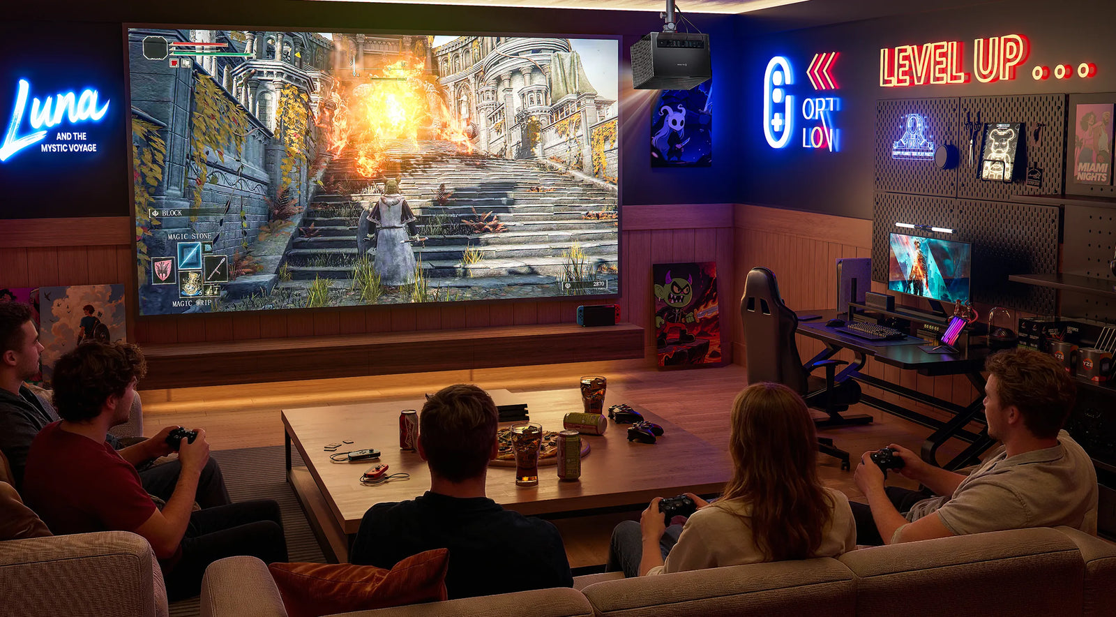 Friends playing games on a large projection screen in a dedicated gaming room with an AWOL Vision projector setup.