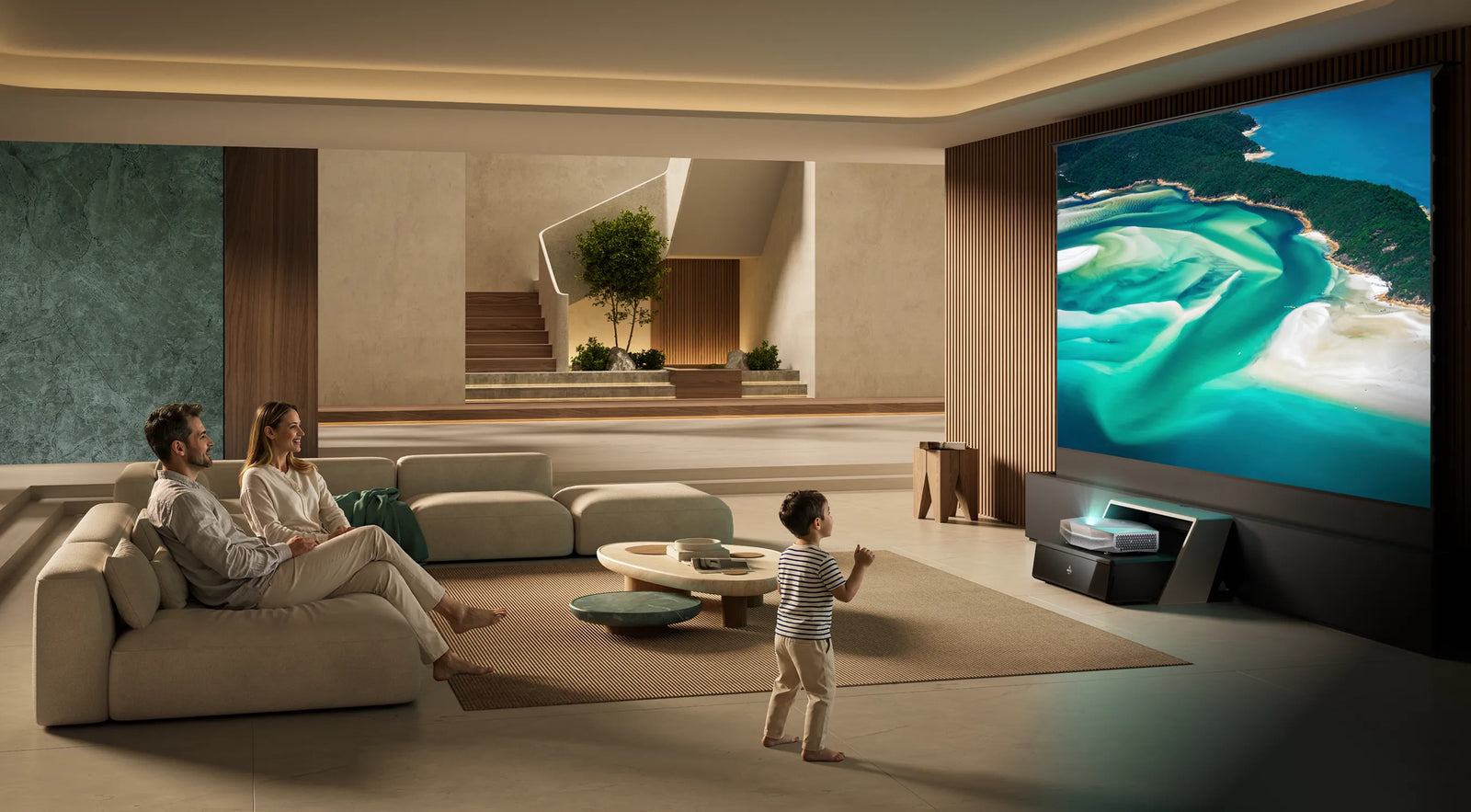 Family enjoying a bright big-screen home cinema experience with an AWOL Vision ultra-short throw projector in a modern living room.
